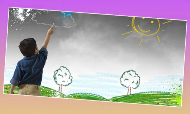 A person is drawing on the wall of a field.